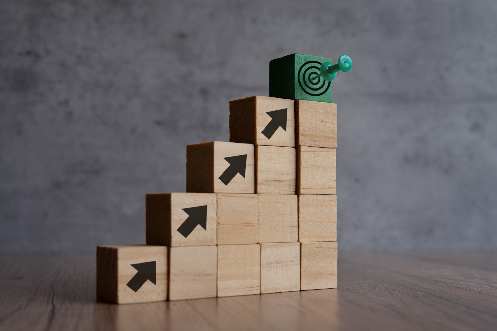 Wooden blocks with arrow and target board.